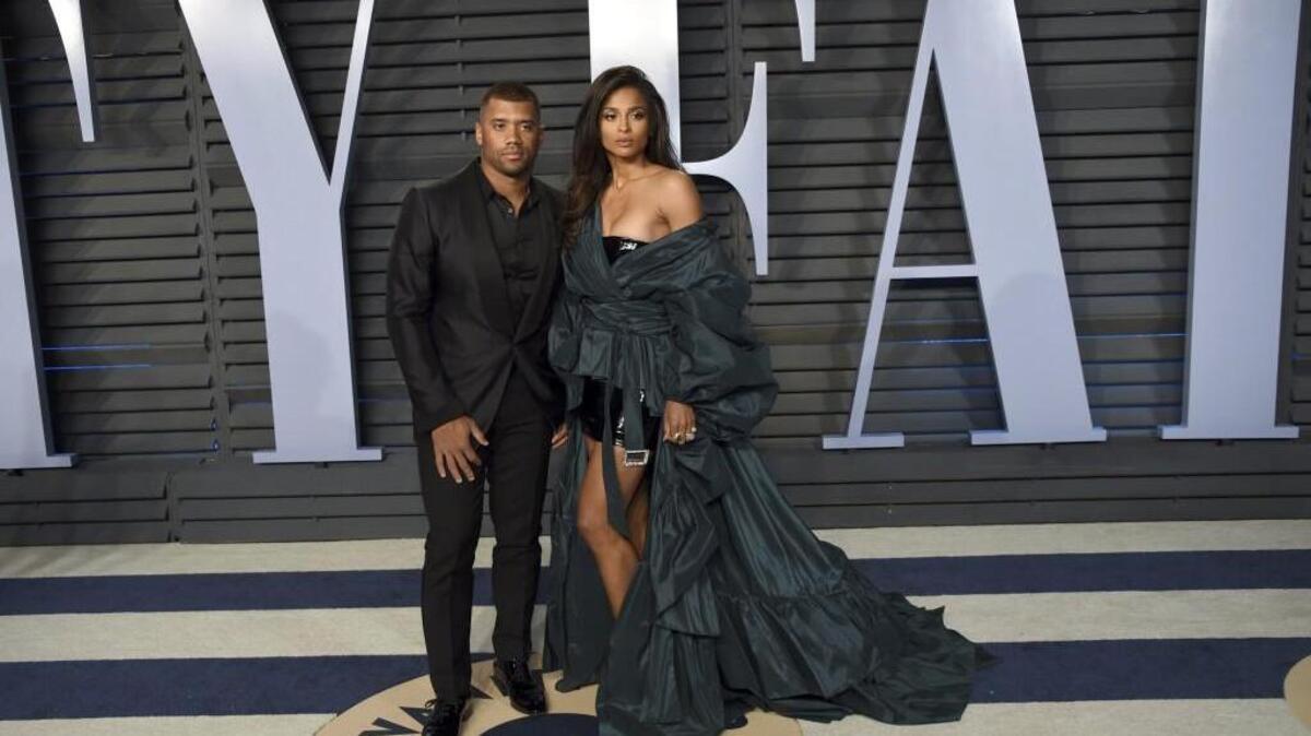 Seahawks quarterback Russell Wilson and his wife Ciara, here at the Vanity Fair Oscar Party in Beverly Hills, Calif., in March, announced Friday they are investing in an effort to bring Major League Baseball to Portland.
