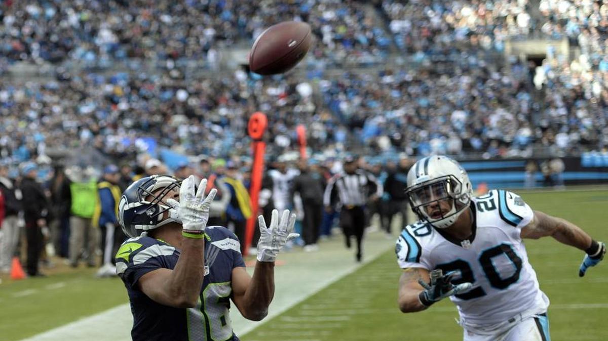 Seattle’s Tyler Lockett, defended by Carolina’s Kurt Coleman, catches a 33-yard touchdown pass from Russell Wilson midway through the third quarter. Lockett finished with three catches for 75 yards, and returned a kickoff for 50 yards.
