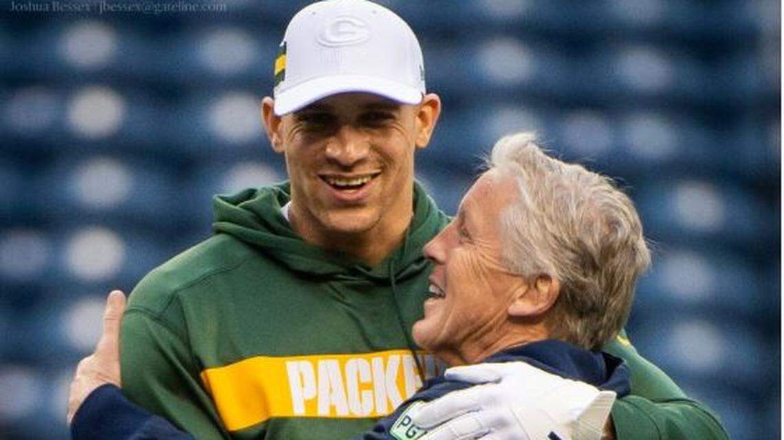 Tight end Jimmy Graham hugs his former Seahawks coach Pete Carroll on the field during pregame warmups before Graham’s Green Bay Packers played Seattle Thursday night at CenturyLink Field.