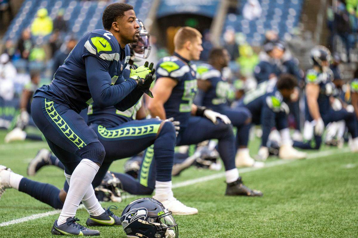 Seahawks cornerback D.J. Reed (2) stretches prior to the start of the Seattle’s game against the Detroit Lions on Sunday, Jan. 2, 2022, at Lumen Field in Seattle.
