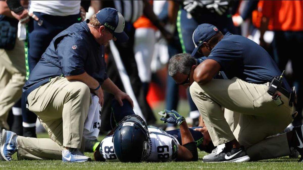 Pro Bowl wide receiver being attended to by Seahawks doctors after he sprained his right knee during the first half of Sunday’s opening-game loss at Denver.
