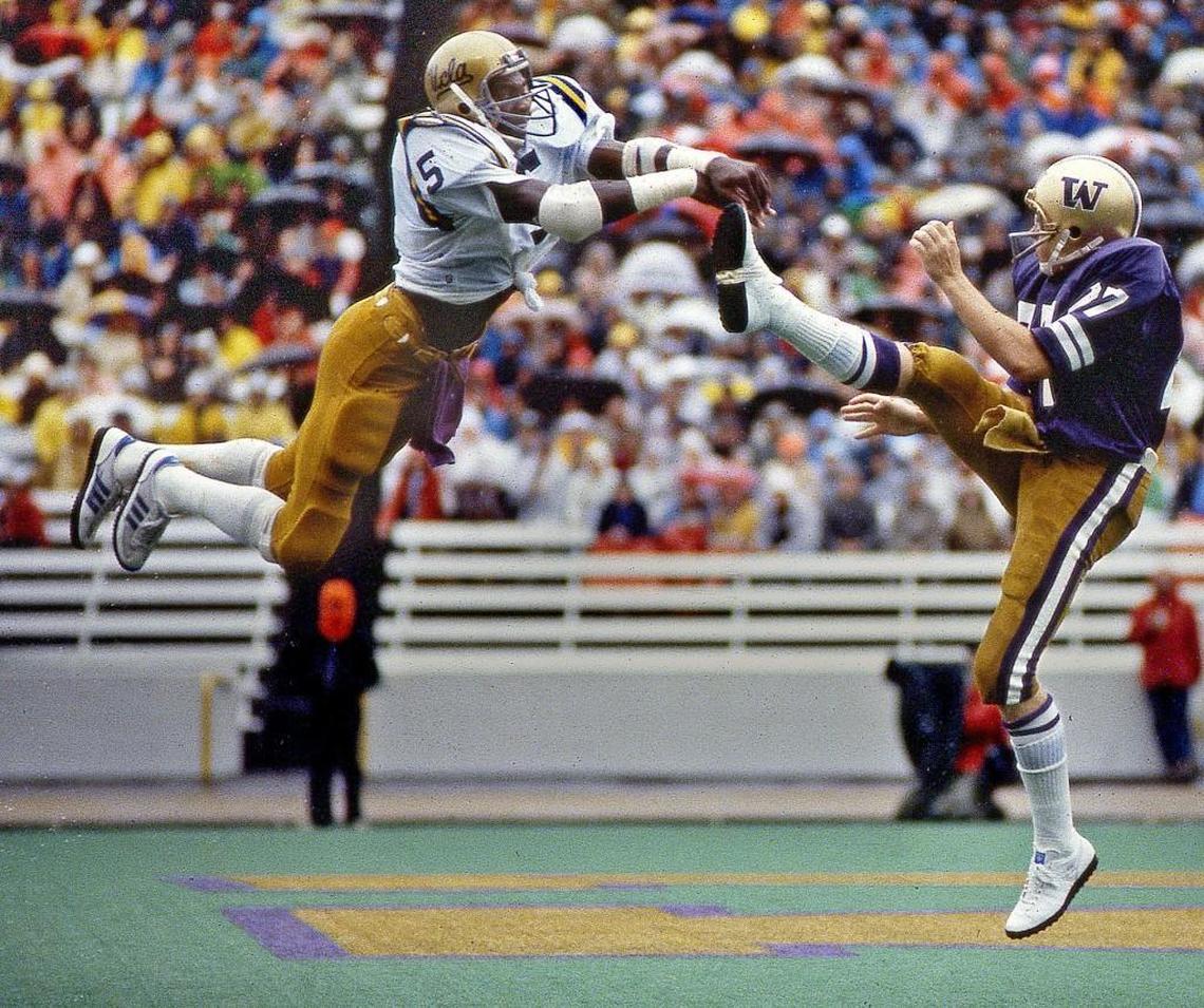 Blitzing UCLA safety Kenny Easley blocks a punt attempt by Washington’s Aaron Wilson in the play some say broke the Huskies’ back in September 9, 1978. When UCLA pounced on the ball for a touchdown they would lead Washington by 10 points on a miserable rainy day at Husky Stadium.