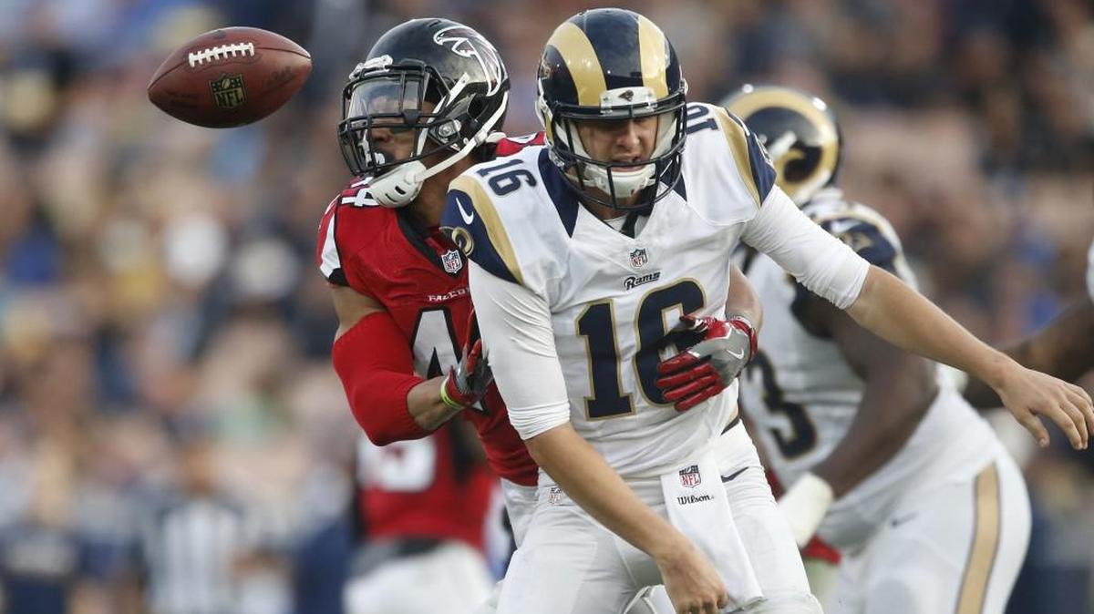 Falcons linebacker Vic Beasley Jr. strips the ball from Rams quarterback Jared Goff this past Sunday.