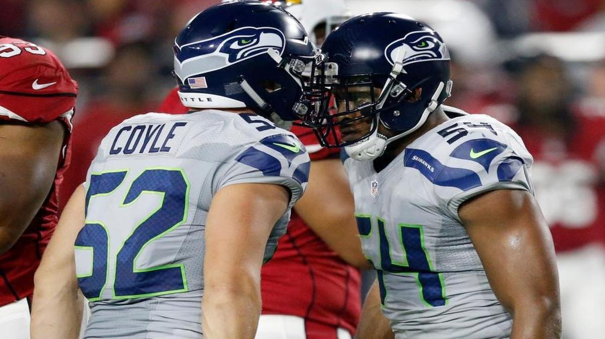 Seattle Seahawks linebacker Bobby Wagner (54) celebrates his blocked field goal against the Arizona Cardinals with teammate Brock Coyle (52) on Sunday.