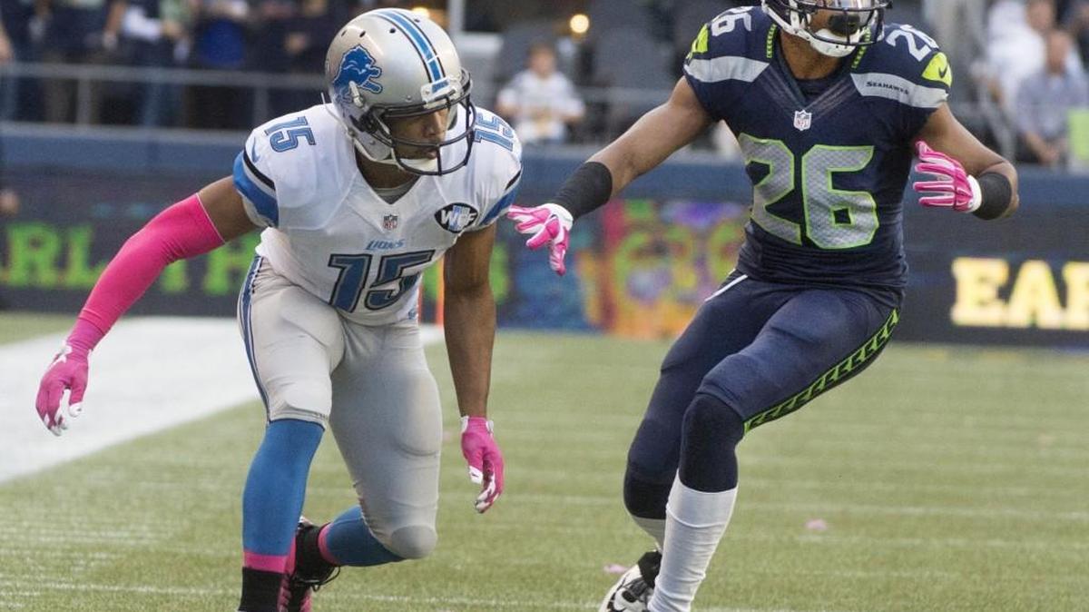 
New Seattle cornerback Cary Williams, right, defends against Detroit receiver Golden Tate during the Seahawks’ 13-10 win Monday over the Lions.
