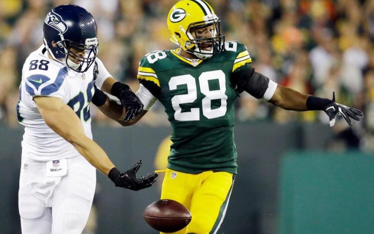 
New Seahawks tight end Jimmy Graham drops a pass as Packers cornerback Sean Richardson defends Sunday in Green Bay. Graham has just seven receptions through two games this season.
