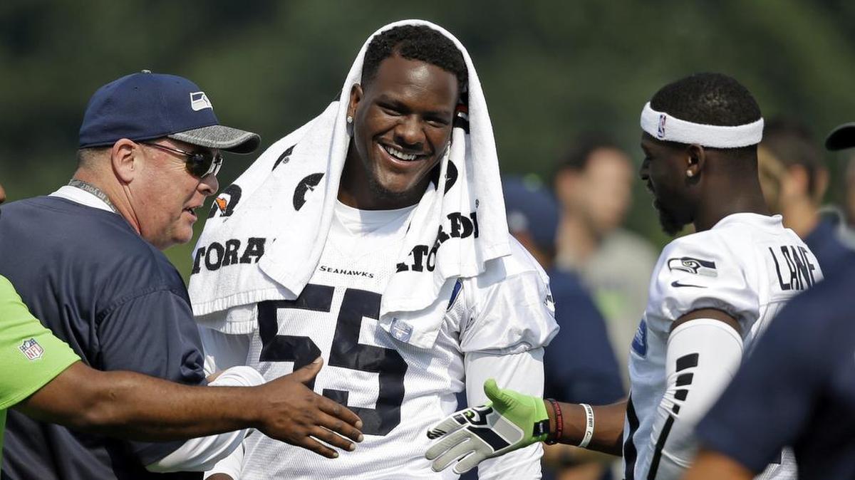 If defensive end Frank Clark, center, remains in the Seahawks’ doghouse after punching starting right tackle Germain Ifedi to the ground on Thursday, it hasn’t been readily apparent on the field this weekend at training camp. This was from Friday, the first of three consecutive days Clark hasn’t practiced since the fight.