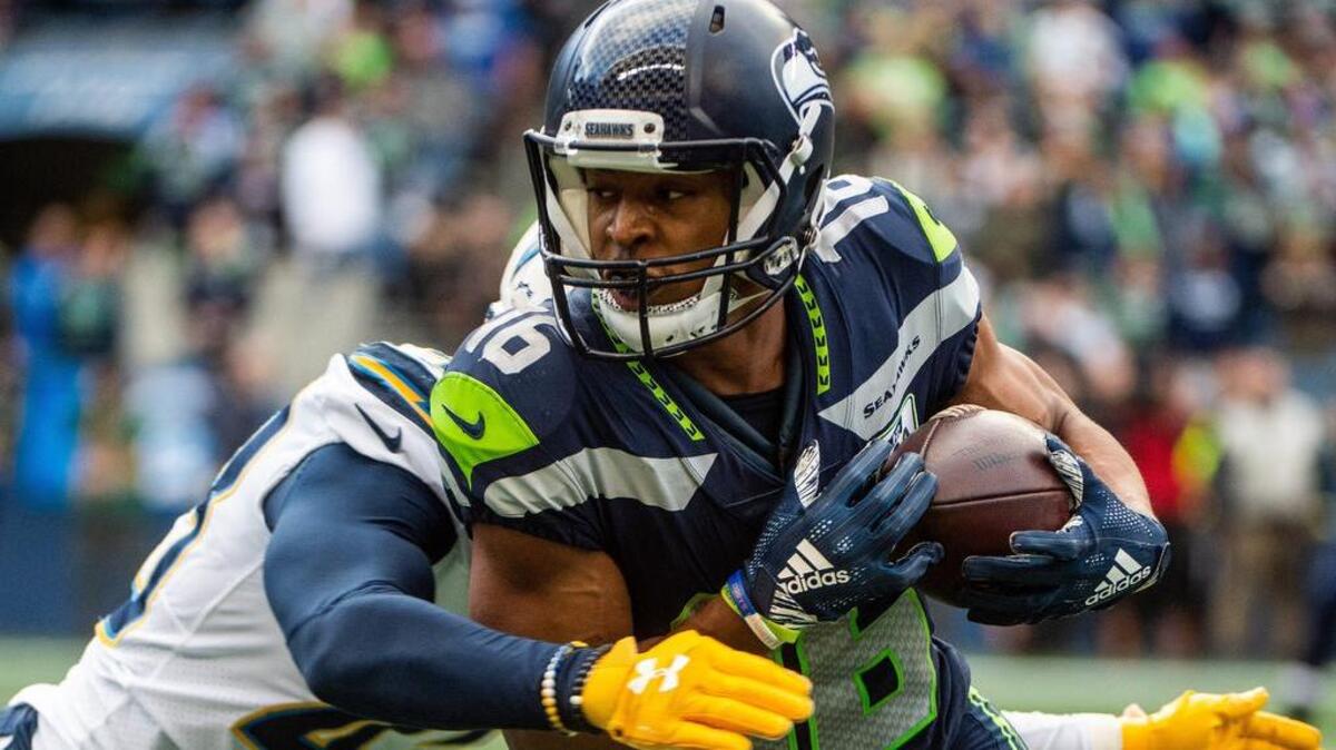 Wide receiver Tyler Lockett, tackled by Chargers cornerback Michael Davis in Seattle’s last home game Nov. 4, is the Seahawks’ 2018 nominee for the NFL’s Art Rooney Sportsmanship Award.