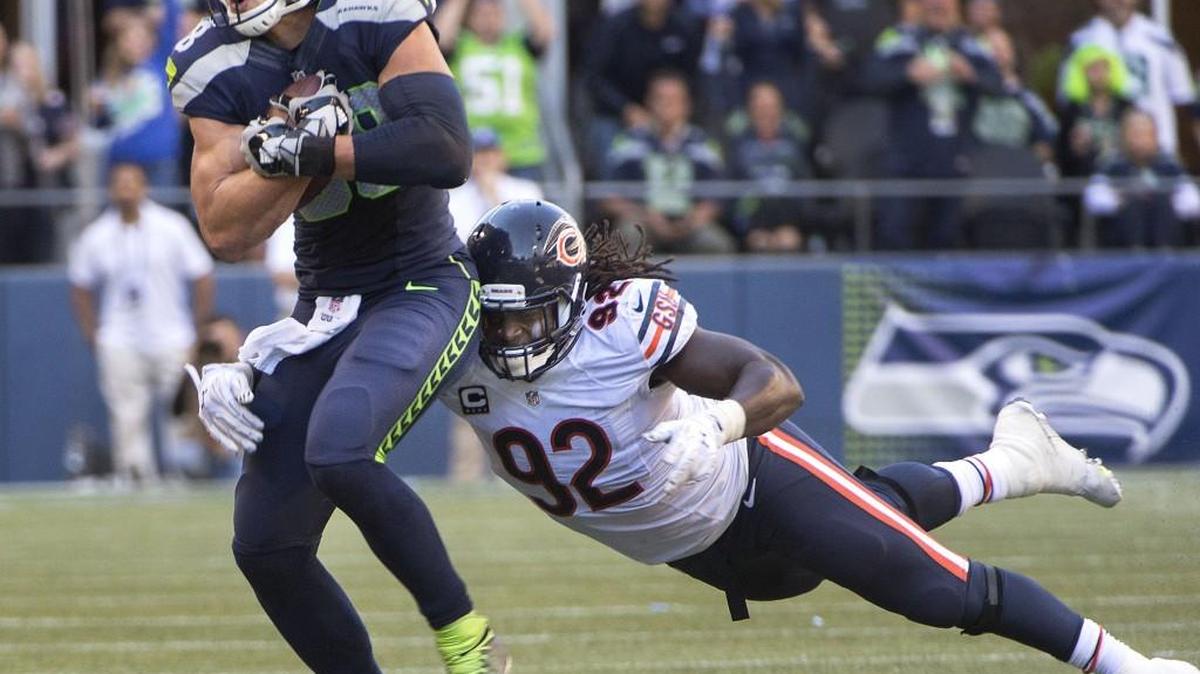 
Seahawks tight end Jimmy Graham breaks a tackle attempt by Bears linebacker Pernell McPhee en route to a first down Sunday. Graham had his best game with Seattle, catching seven passes for 83 yards and a touchdown.
