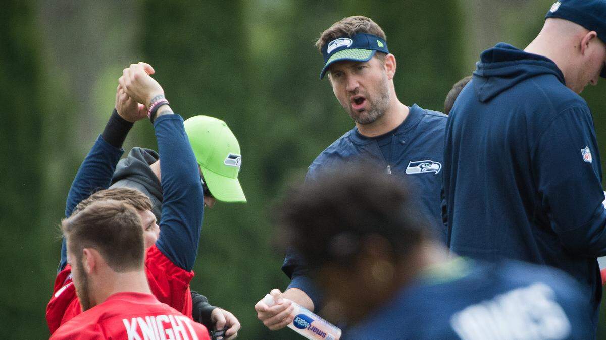 New offensive Coordinator Brian Schottenheimer calls out during Seahawks rookie minicamp at the Virginia Mason Athletic Center in Renton on Friday. Through two days of rookie drills it's already noticeable how, in coach Pete Carroll's words "very active" Schottenheimer is on the field.