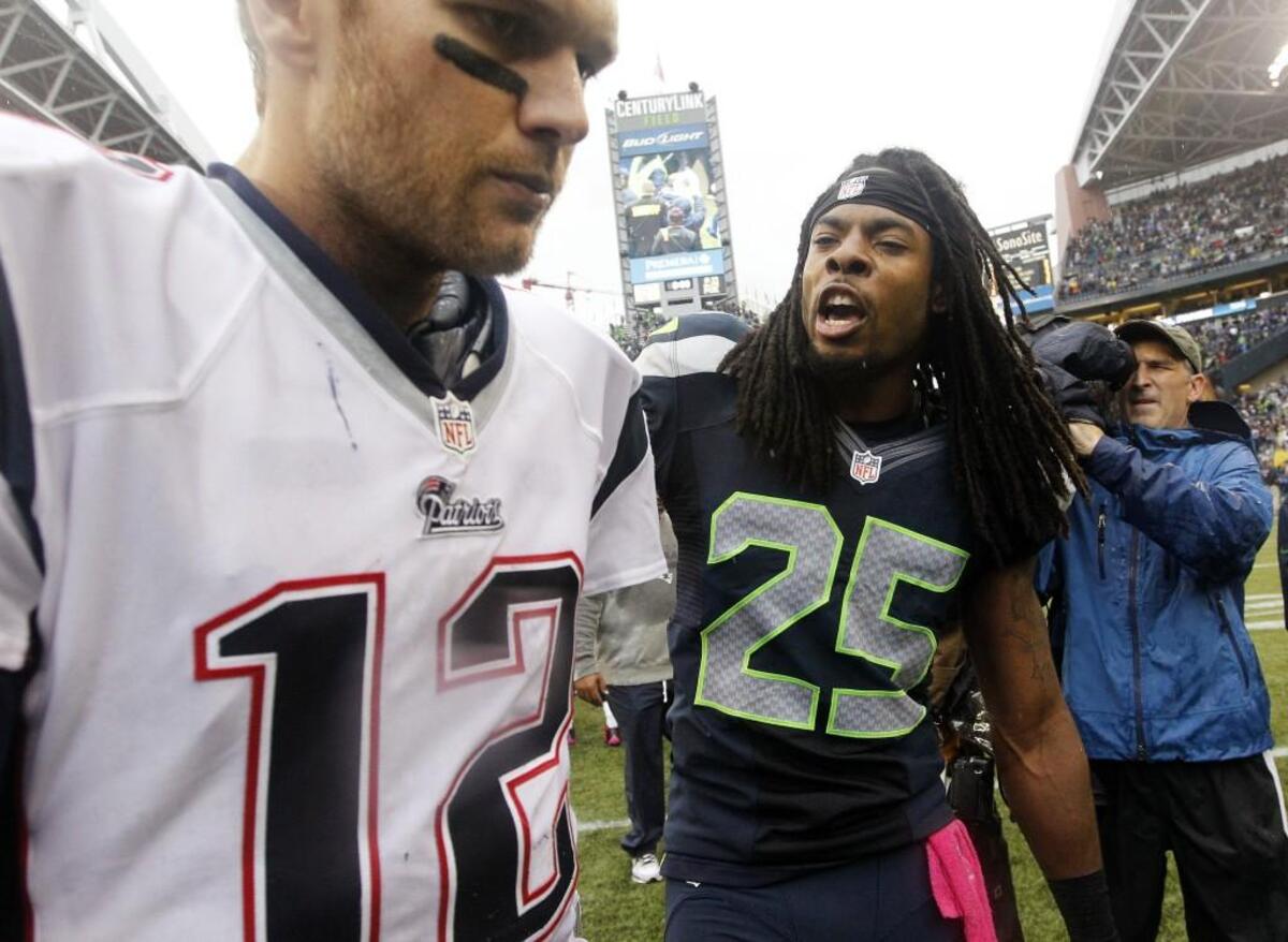 Seahawks then-second-year cornerback Richard Sherman gets into the face of New England championship quarterback Tom Brady after Sherman intercepted him and upstart Seattle beat Brady’s Patriots 24-23 on Oct. 14, 2012, at CenturyLink Field.