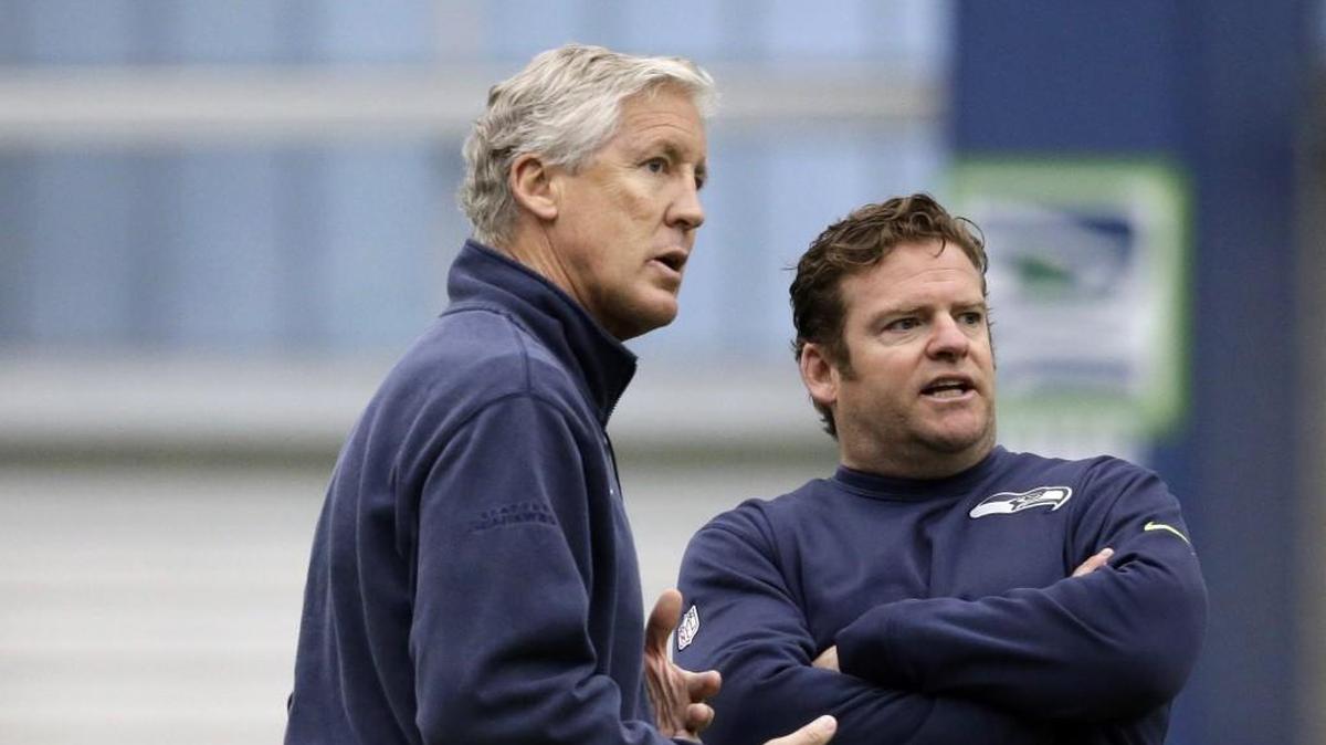 Coach Pete Carroll, left, and general manager John Schneider currently have just four selections in this spring’s seven-round NFL draft. That the Seahawks’ fewest since they took over the team in 2010. Their habit of draft trades down in and even out of the first round in previous years is an imperative in this one.