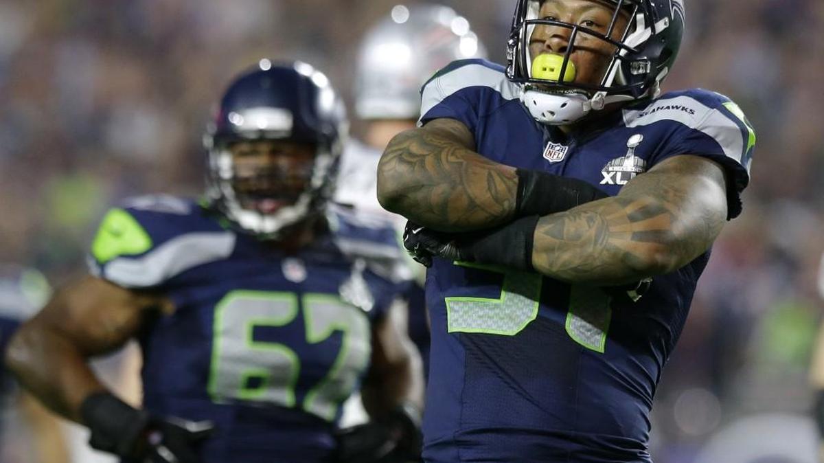 Bruce Irvin, here celebrating a sack of Tom Brady in Super Bowl 49 in February 2015, is reportedly leaving the Seahawks to sign a big, free-agent contract with the Oakland Raiders.