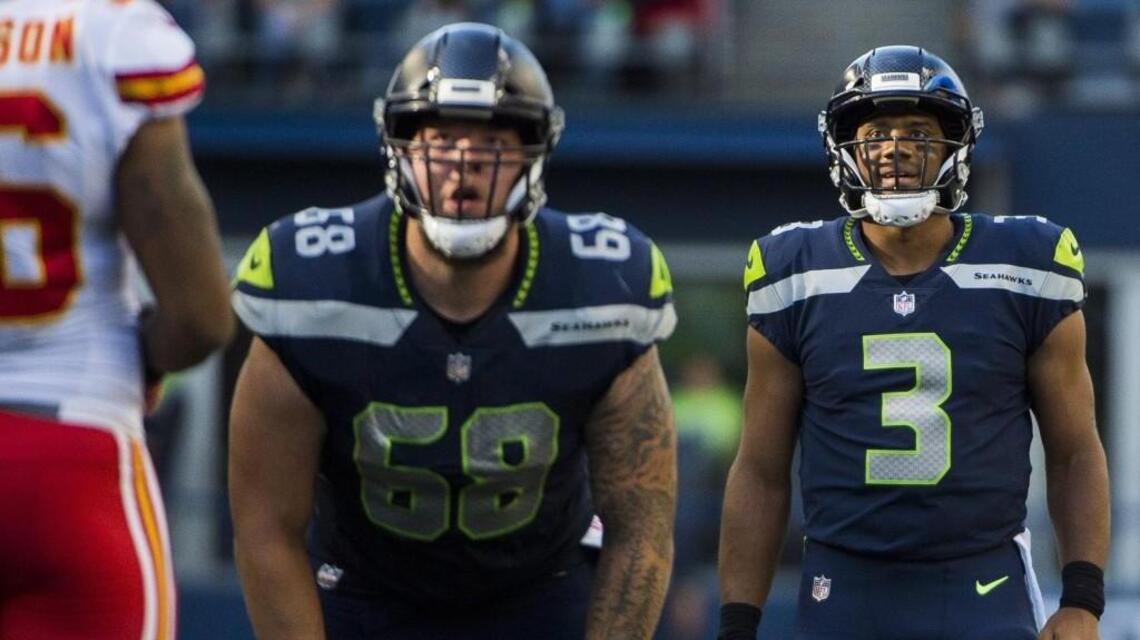 One sure thing: Seahawks pick up $5 million option to keep center Justin Britt under contract through 2020