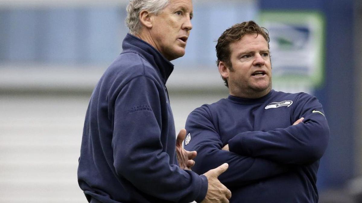Seahawks coach Pete Carroll, left, and general manager John Schneider have in the last week traded Pro Bowl defensive end Michael Bennett, waived three-time All-Pro cornerback Richard Sherman--then watched him sign with rival San Francisco on Saturday--and waived defensive back Jeremy Lane. That saved them $17.95 million in salary cap space. So what will they do this week as free agency begins?