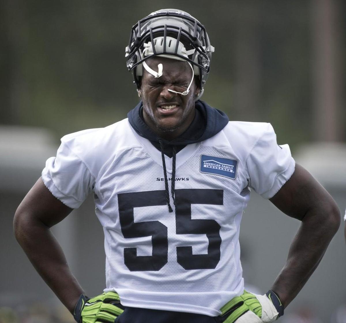 Frank Clark wore an ice pack on his lower right leg instead of practicing Monday in the Seahawks’ first drills of training camp in shoulder pads. Coach Pete Carroll thought Clark’s issue was “minor.”