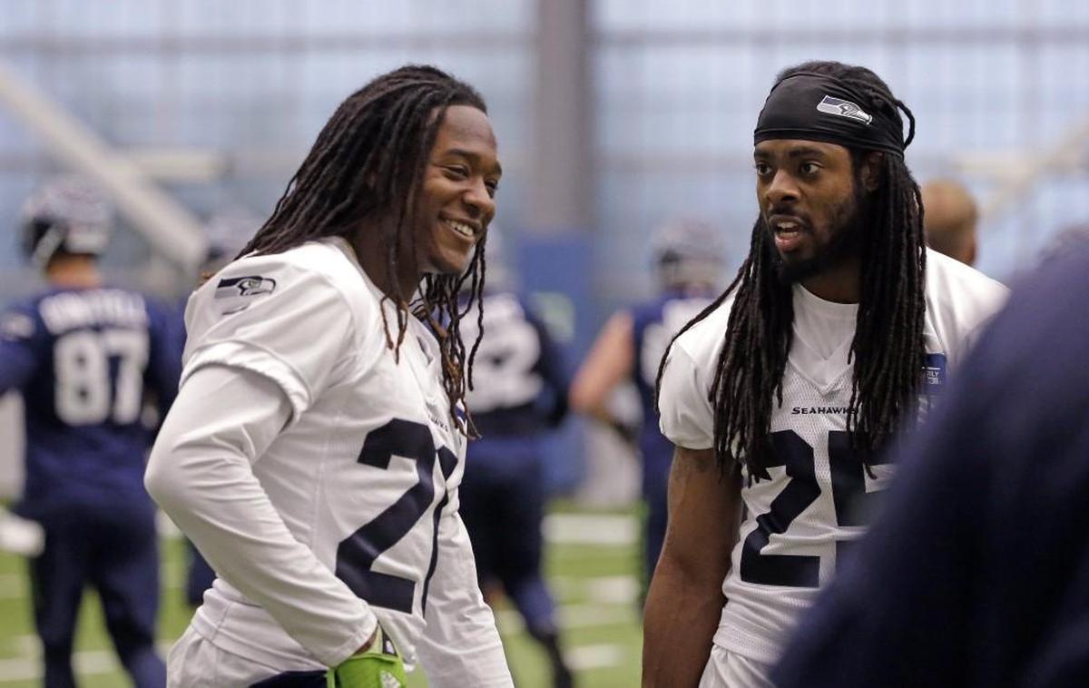 Then-rookie third-round pick Shaquill Griffin (left) learning on the field from All-Pro Richard Sherman (right) during offseason practice in the spring of 2017 at Seahawks headquarters. Griffin started at right cornerback last year as a rookie, and is starting this season at Sherman’s old left-cornerback spot.