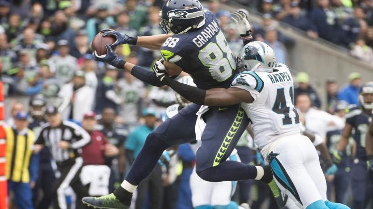 
Seahawks tight end Jimmy Graham pulls down a pass reception over Panthers safety Roman Harper during Sunday’s game at CenturyLink Field.
