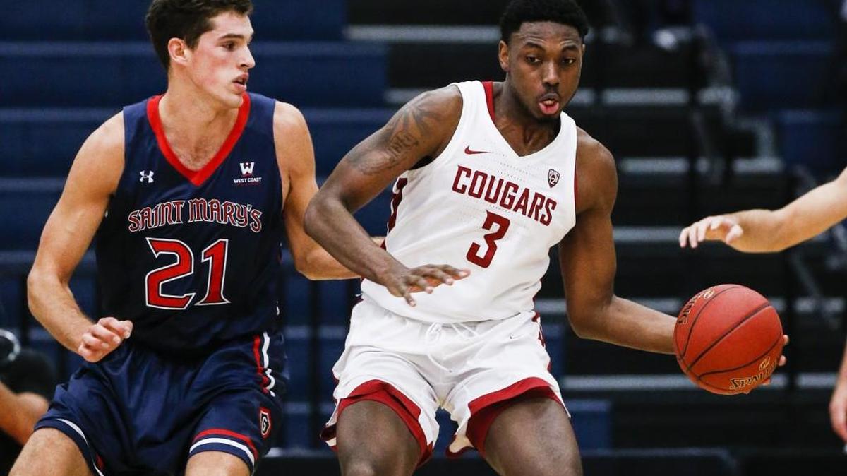 Washington State forward Robert Franks takes on Saint Mary's center Evan Fitzner during the Wooden Legacy tournament in November. Since his freshman season, Franks has lost 25 pounds and has become a key member of WSU’s rotation.