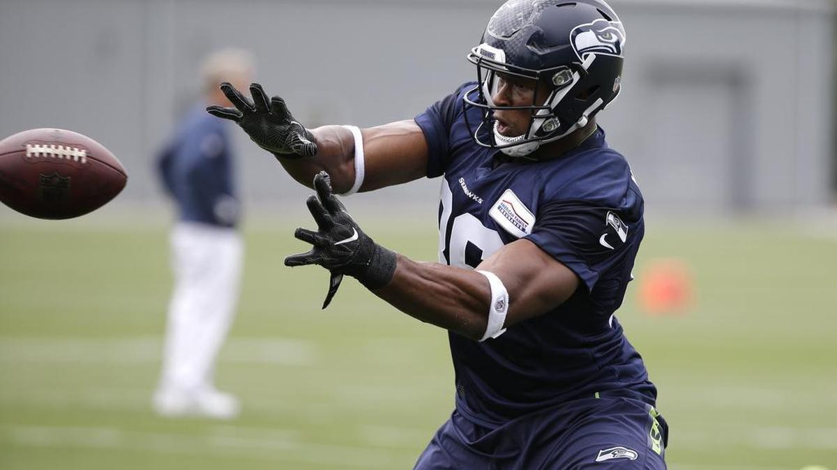 Tight end Brandon Williams reaches for a pass at this summer’s Seahawks camp. Williams is seeking a Seattle roster spot after spending three seasons with Carolina and Miami. “I’m grateful to be out here every day,” he says.