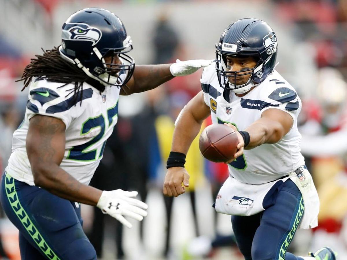 Seattle Seahawks' Eddie Lacy (27) receives the handoff from Seattle Seahawks' Russell Wilson (3) against the San Francisco 49ers in the fourth quarter on Sunday, Nov. 26, 2017 at Levi's Stadium in Santa Clara, Calif.