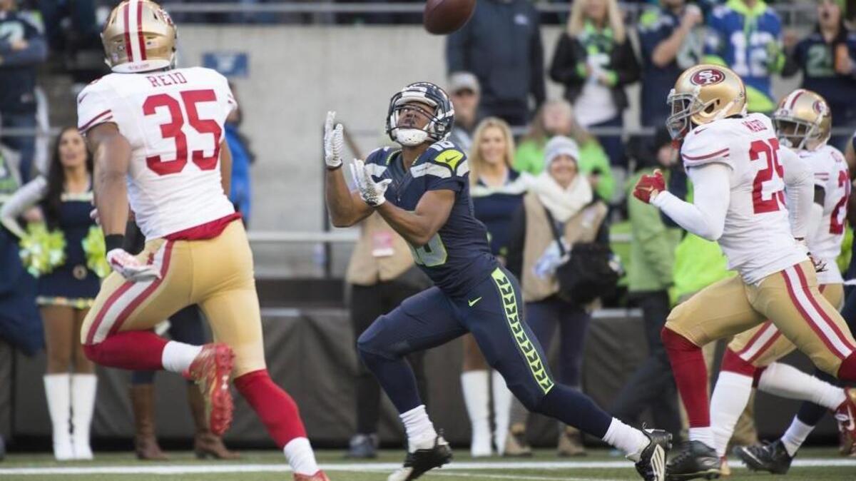Seahawks receiver Tyler Lockett pulls in a 24-yard touchdown pass from Russell Wilson during the first quarter. Lockett also scored on a 11-yard pass in the second quarter.