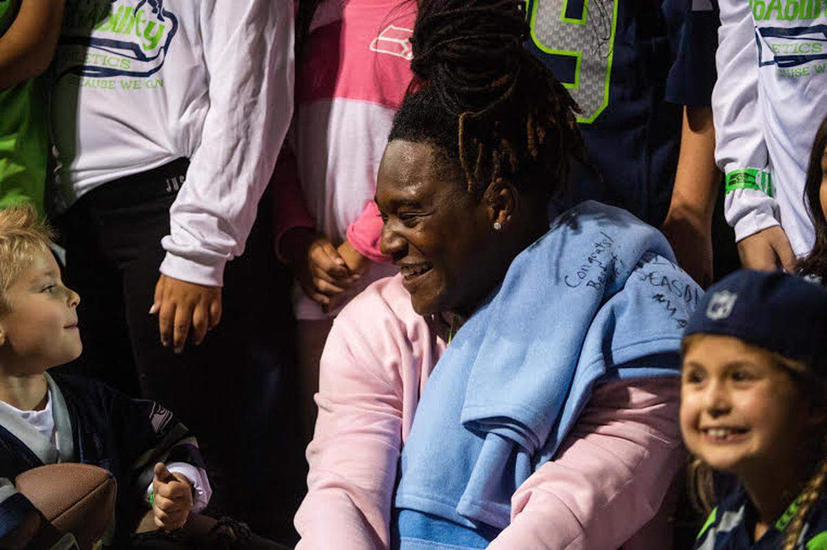 Seahawks rookie linebacker Shaquem Griffin smiles and poses for photos with kids with the NubAbility Athletics Foundation after he started Thursday’s preseason finale against Oakland at CenturyLink Field.