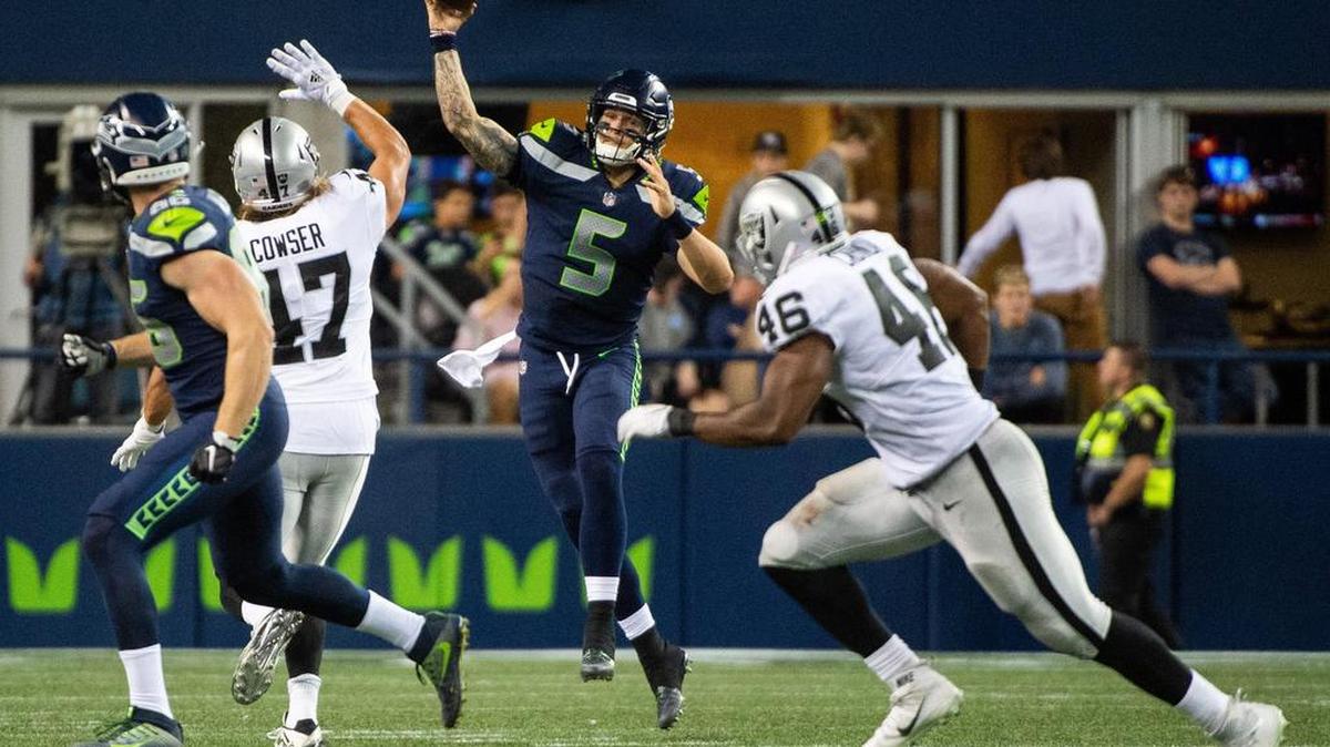 Seahawks quarterback Alex McGough (5) throws a pass in the third quarter. The Seattle Seahawks played the Oakland Raiders in a NFL preseason game at CenturyLink Field in Seattle, Wash., on Thursday, Aug. 30, 2018.