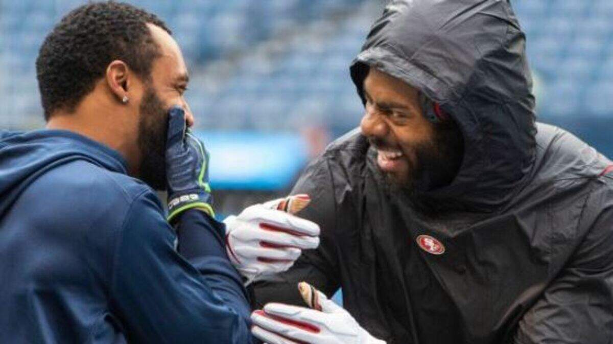 Pro Bowl wide receiver Doug Baldwin (left) and three-time All-Pro cornerback Richard Sherman share a laugh during pregame warmups at CenturyLink Field before the former Seahawks and Stanford teammates played against each other for the first time. Sherman’s San Francisco 49ers played Seattle on Sunday.