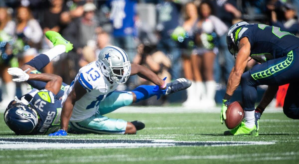 Earl Thomas (29) pins a pass from Dallas’ Dak Prescott off his shin and top of his shoe for an interception in the first quarter of the Seahawks’ win over the Cowboys last weekend. That’s part of the reason fellow Seahawks All-Pro Bobby Wagner calls Thomas “a baller,” and why Wagner and many teammates don’t mind Thomas skipping practices in anger of his contract situation.
