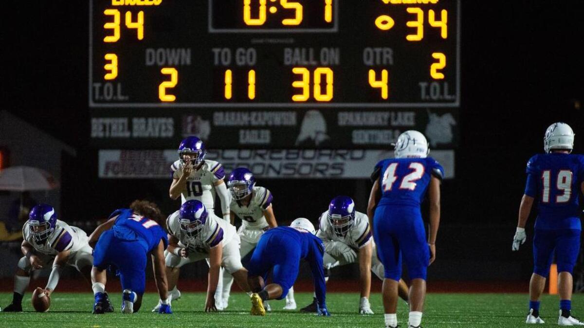 Puyallup’s Jacob Holcomb (10) prepares to get the ball in the fourth quarter. Graham-Kapowsin played Puyallup in a football game at Art Crate Field in Spanaway, Wash., on Friday, Sept. 21, 2018.