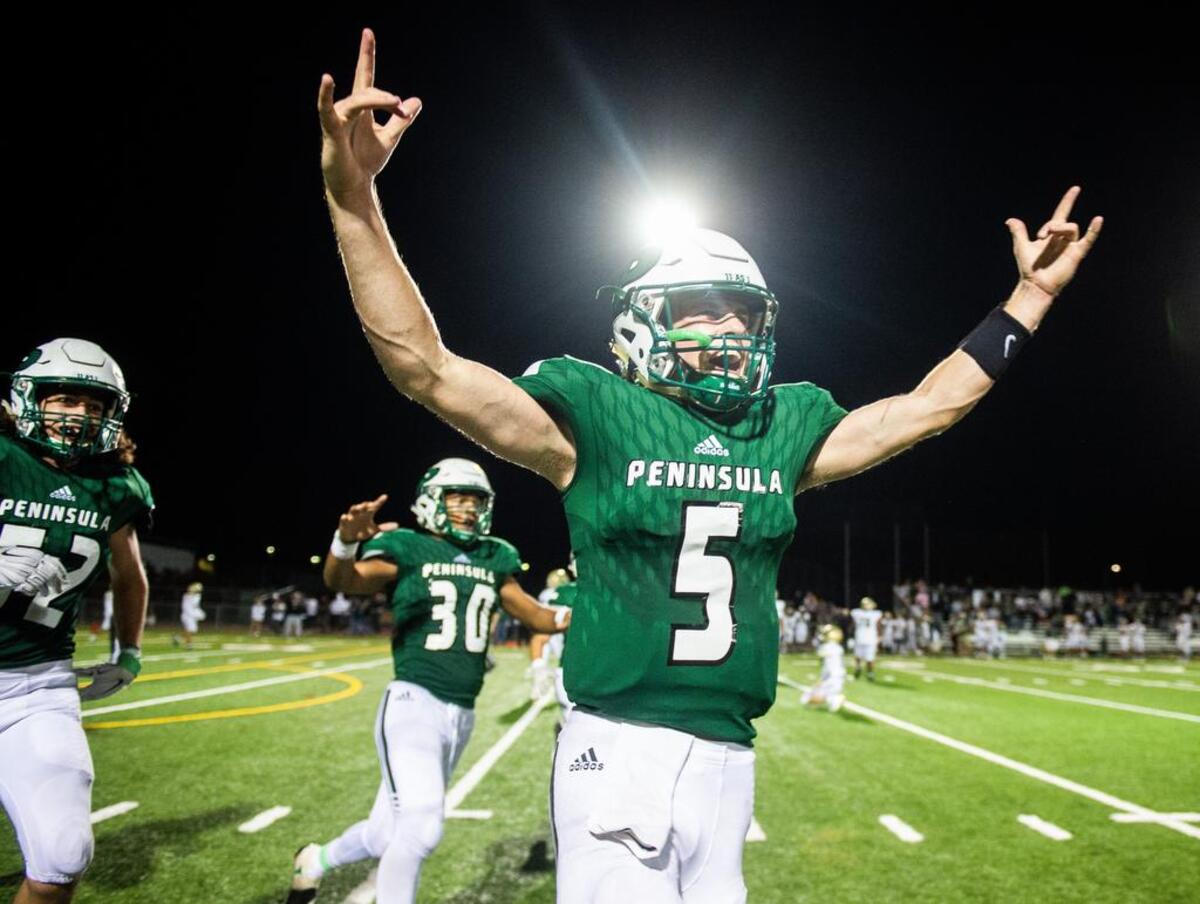 Peninsula’s Burke Griffin (5) celebrates after a failed two-point conversion by Timberline in overtime to give the Seahawks a 28-27 win. Peninsula High School played Timberline High School in a football game at Roy Anderson Field in Purdy, Wash., on Thursday, Sept. 27, 2018.
