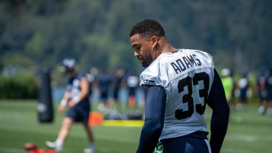 Seattle Seahawks safety Jamal Adams watches the first day of training camp at the Virginia Mason Athletic Center on July 27, 2022. Adams didn’t attend day two as he was getting second opinions on his surgically repaired hand.