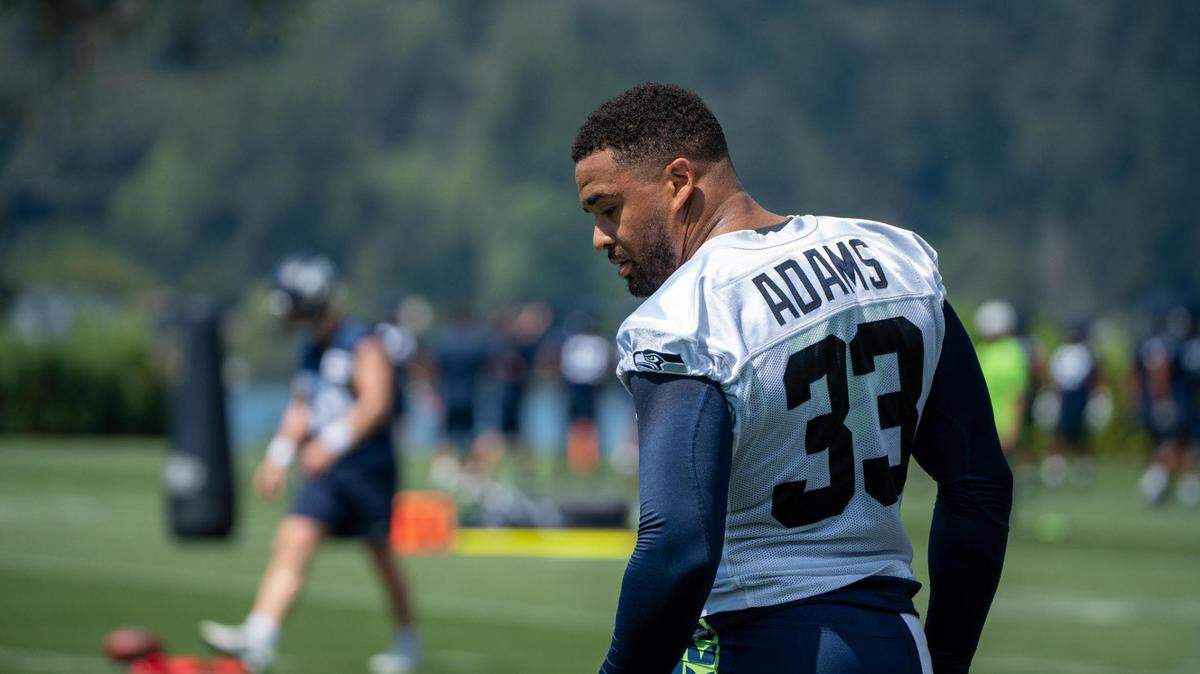 Seattle Seahawks safety Jamal Adams watches the first day of training camp at the Virginia Mason Athletic Center on July 27, 2022. Adams didn’t attend day two as he was getting second opinions on his surgically repaired hand.