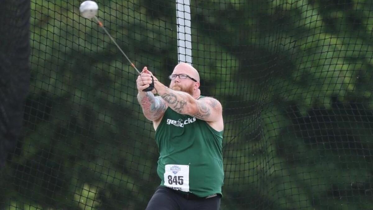 Evergreen’s Zeb Hoffman, a 37-year-old senior, is the defending NAIA national champion in the hammer throw.