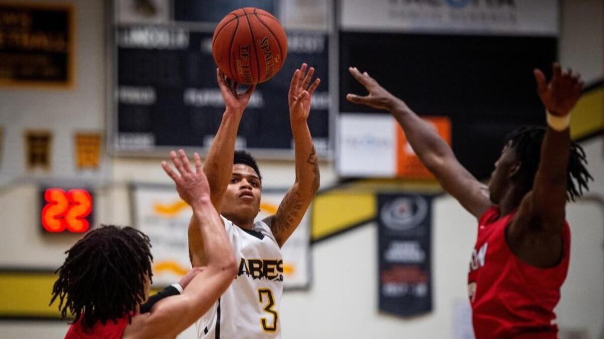 Lincoln’s Kashaud Babbs (3) takes a three-point-shot in the first quarter. Lincoln played Wilson at Lincoln High School in Tacoma, Wash., on Wednesday, Jan. 9, 2019.