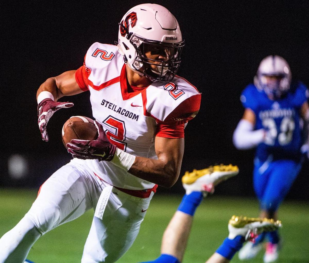 Steilacoom’s Emeka Egbuka (2) runs after a catch in the first quarter. Eatonville played Steilacoom at Eatonville High School in Eatonville, Wash., on Friday, Oct. 12, 2018.