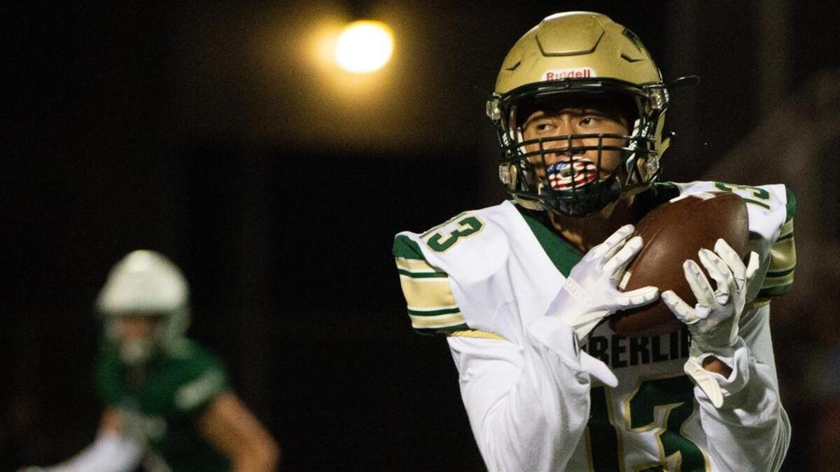 Timberline’s Max Aunese catches a pass in the fourth quarter. Peninsula High School played Timberline High School in a football game at Roy Anderson Field in Purdy, Wash., on Thursday, Sept. 27, 2018.