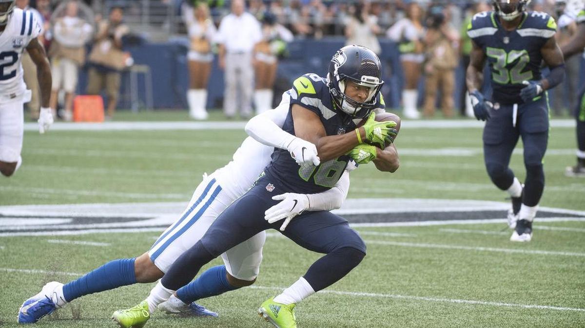 Now-former Colts safety T.J. Green brings down Seahawks wide receiver Tyler Lockett during a preseason game in August at CenturyLink Field. Seattle signed Green on Tuesday. He’s played in 31 of 32 games the past two seasons, both at free and strong safety.