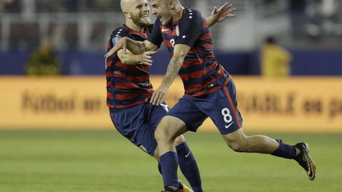 Jordan Morris (8) celebrates after scoring a goal against Jamaica with Michael Bradley during the second half of the Gold Cup final soccer match on Wednesday.