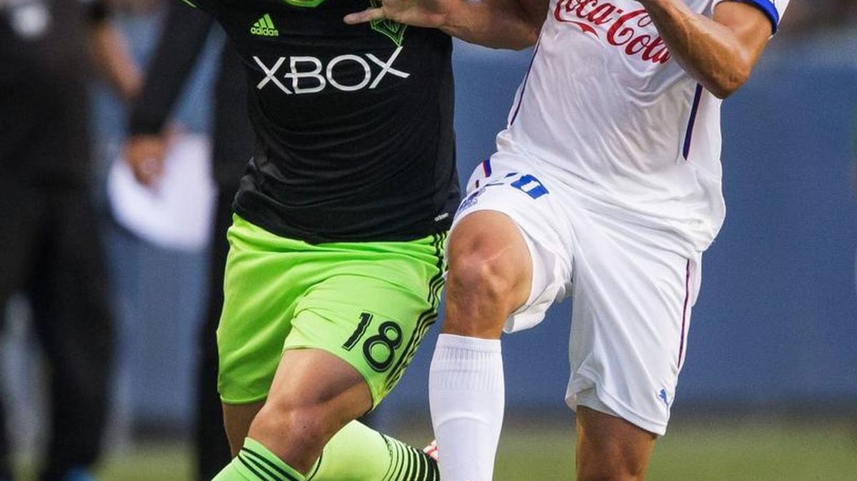 
Seattle’s Thomás, left, drives against C.D. Olimpia's Oliver Morazan during the first half of the Sounders’ 2-1 win in a CONCACAF Champions League soccer match on Aug. 19 in Seattle. The two teams will play against on Wednesday in the Honduras. 

