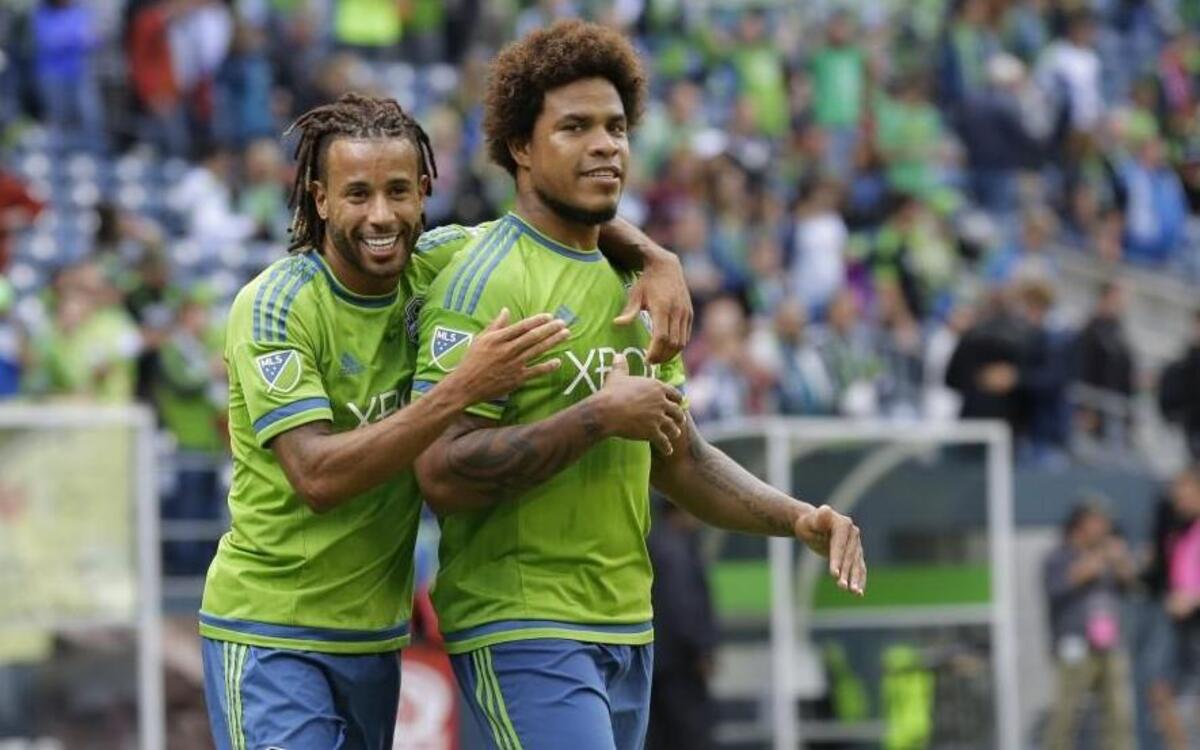
Sounders central defender Roman Torres, right, celebrates with Tyrone Mears after they beat the Portland Timbers last month. Torres tore his anterior cruciate ligament Saturday against San Jose and will miss betwee six and nine months.

