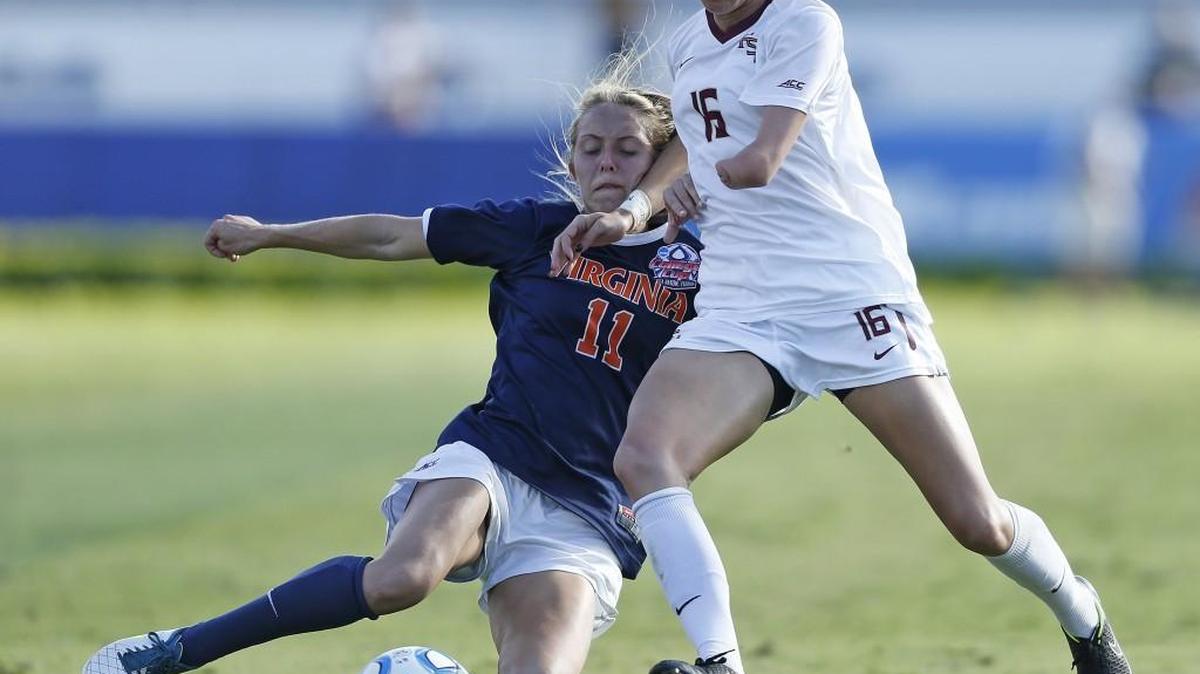 Virginia’s Brittany Ratcliffe (11) and Florida State’s Carson Pickett battle for the ball during the second half of the Women's NCAA College Cup final in Boca Raton, Fla., in 2014. Pickett is set to replace Stephanie Cox in the Seattle Reign’s defense this season after Cox retired.