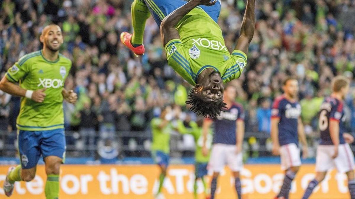 Sounders forward Obafemi Martins does a backflip after scoring during a match against New England in March.