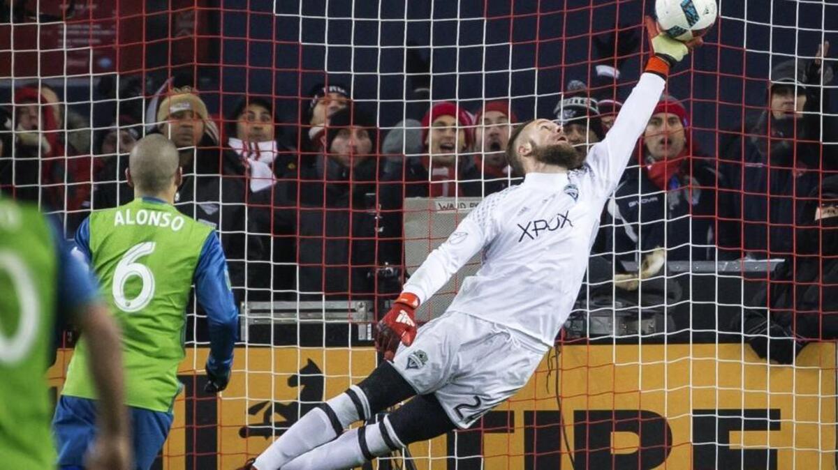 Seattle Sounders goalkeeper Stefan Frei makes a one-handed save on a shot from Toronto FC forward Jozy Altidore to keep the game tied at 0-0 during the MLS Cup soccer game at BMO Field in Toronto last year.