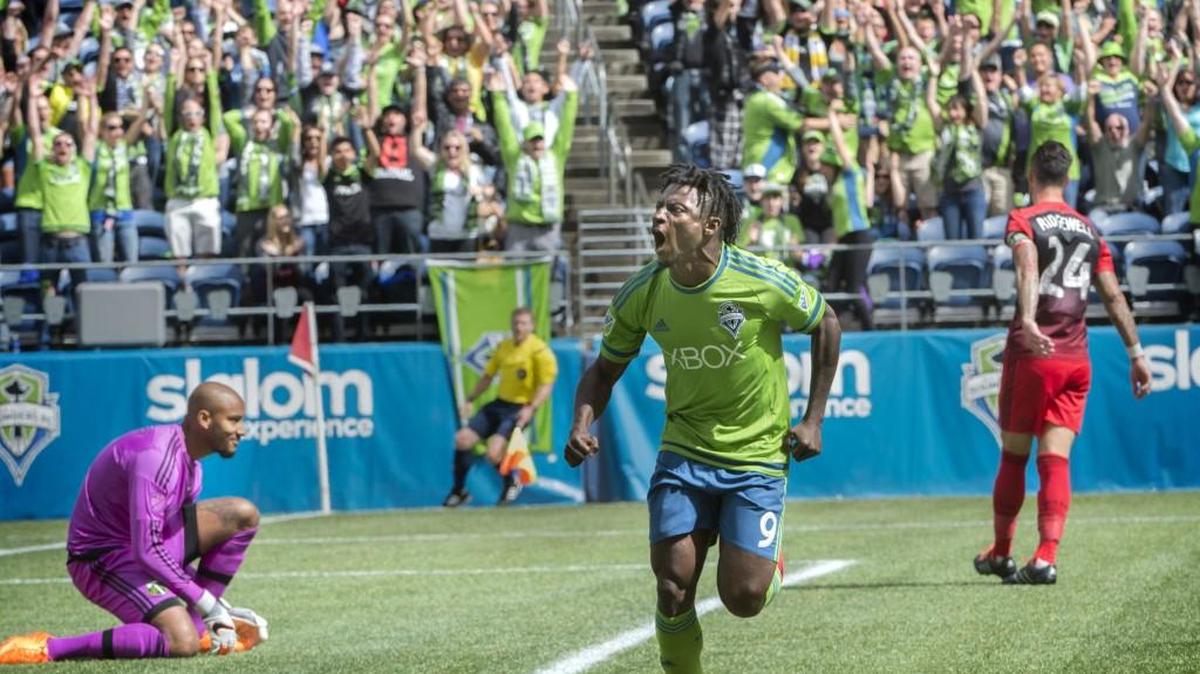 
Sounders forward Obafemi Martins celebrates his goal which left Timbers goalie Adam Kwarasey frozen Sunday at CenturyLink Field.

