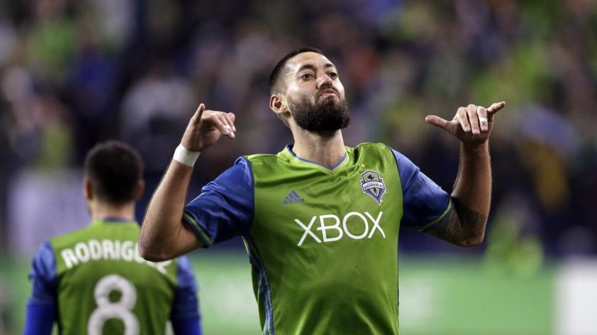 Seattle Sounders' Clint Dempsey celebrates after his second goal on Thursday. The goals were the first for Dempsey in two years and lifted Seattle into the Western Conference finals.