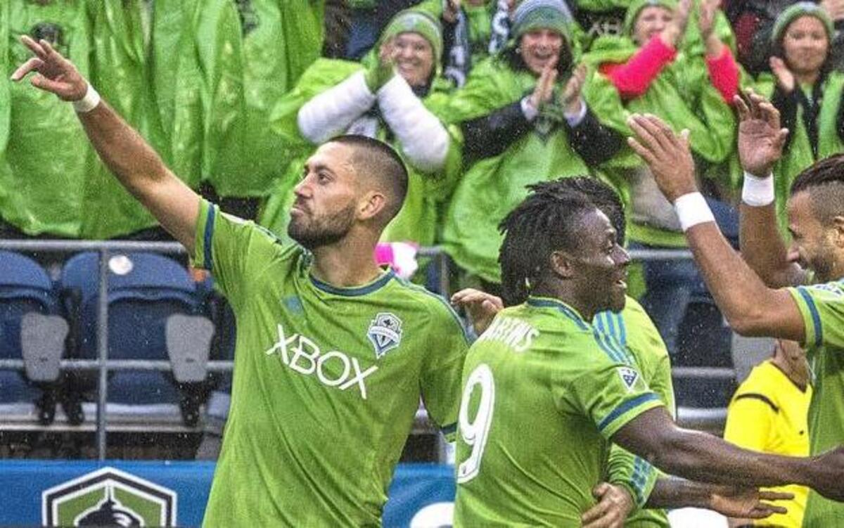 Sounders forward Clint Dempsey, left, acknowledges the crowd Sunday after scoring his second goal against Real Salt Lake in a 3-1 win for Seattle at CenturyLink Field. The Sounders will play host to the Los Angeles Galaxy in a playoff elimination game later this week.