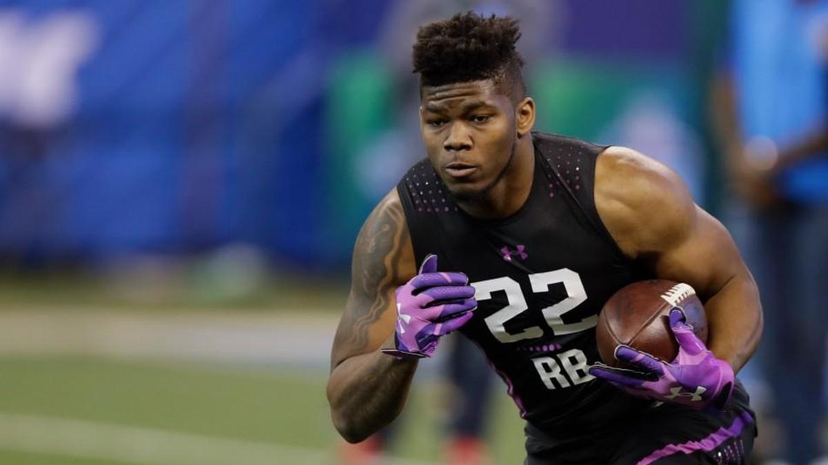 San Diego State running back Rashaad Penny runs a drill during the NFL football scouting combine, Friday, March 2, 2018, in Indianapolis. (AP Photo/Darron Cummings)
