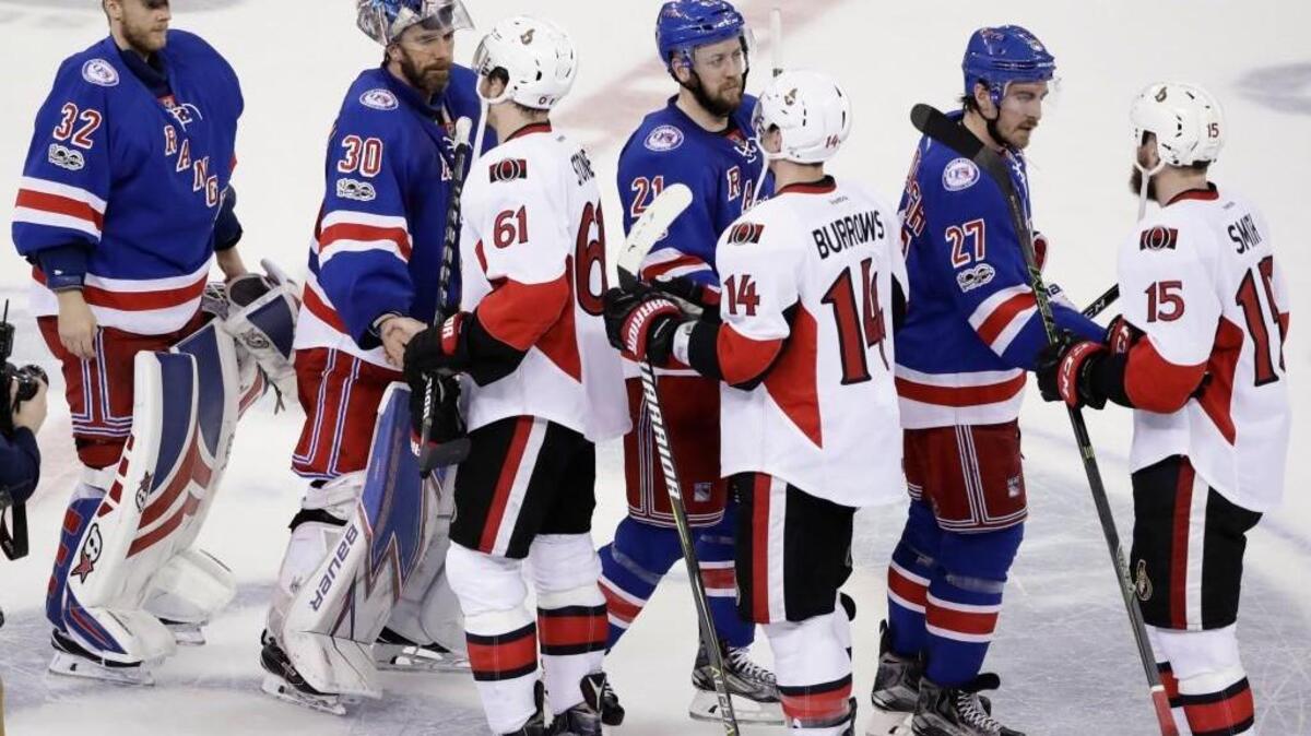 New York Rangers’ Antti Raanta (32), Henrik Lundqvist (30), Derek Stepan (21) and Ryan McDonagh (27) shake hands with Mark Stone (61), Alex Burrows (14) and Zack Smith (15) after Game 6 of a Stanley Cup second-round playoff series on May 9, 2017, in New York. The Senators won 4-2.